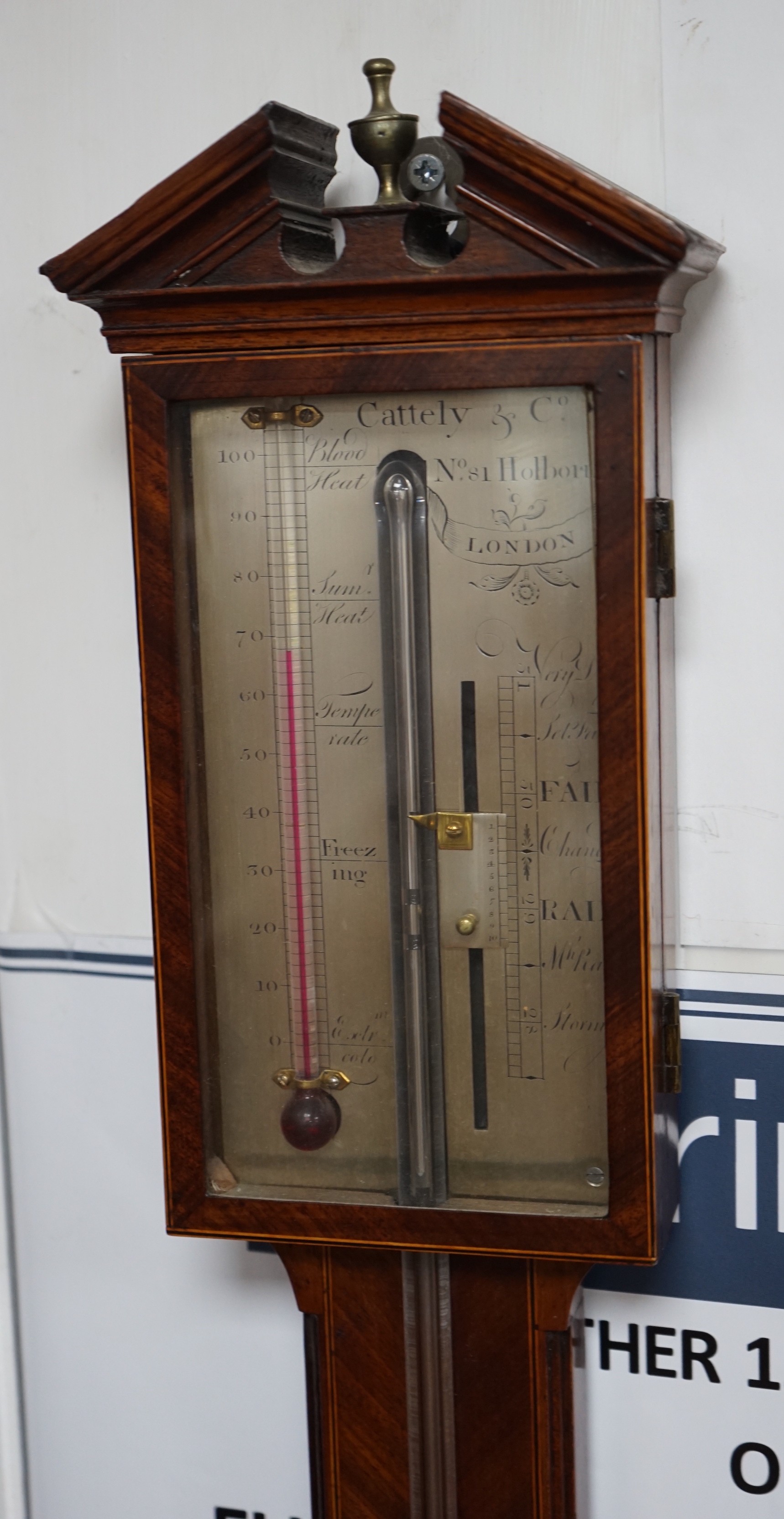 Cattely & Co, Holborn, London. A George III feathered walnut stick barometer, height 98cms. Height 98 cm